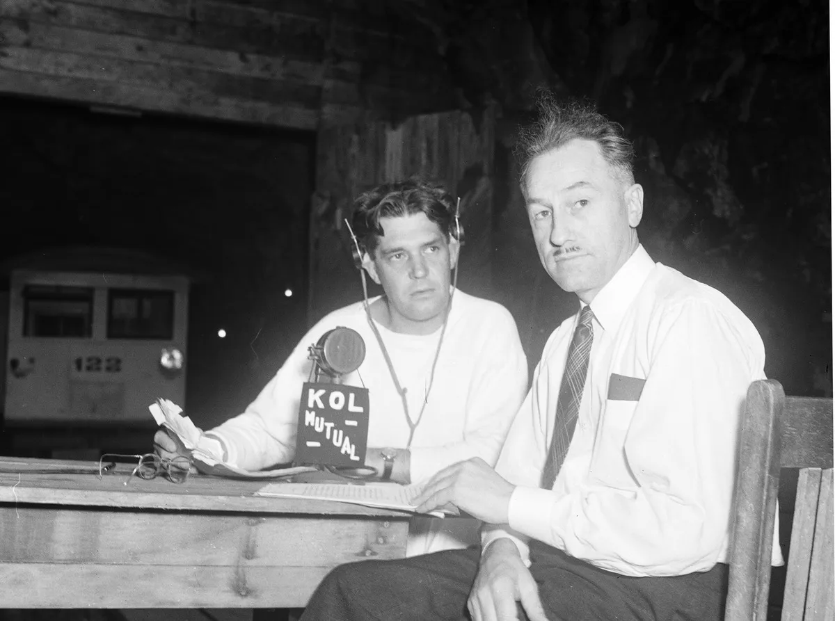 Announcer Dudley Williamson and Seattle City Light Superintendent Eugene Hoffman broadcasting The Romance of Power live from the Skagit on KOL, Seattle, Washing